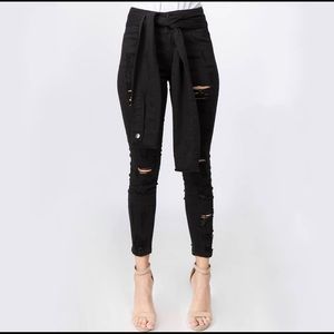 Tie waist denim distressed jeans.